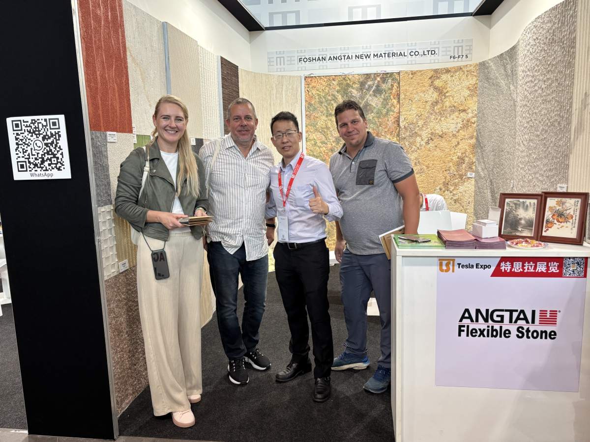 Angtai New Materials booth at Marmomac 2025 with enthusiastic visitors and staff interacting with flexible stone displays